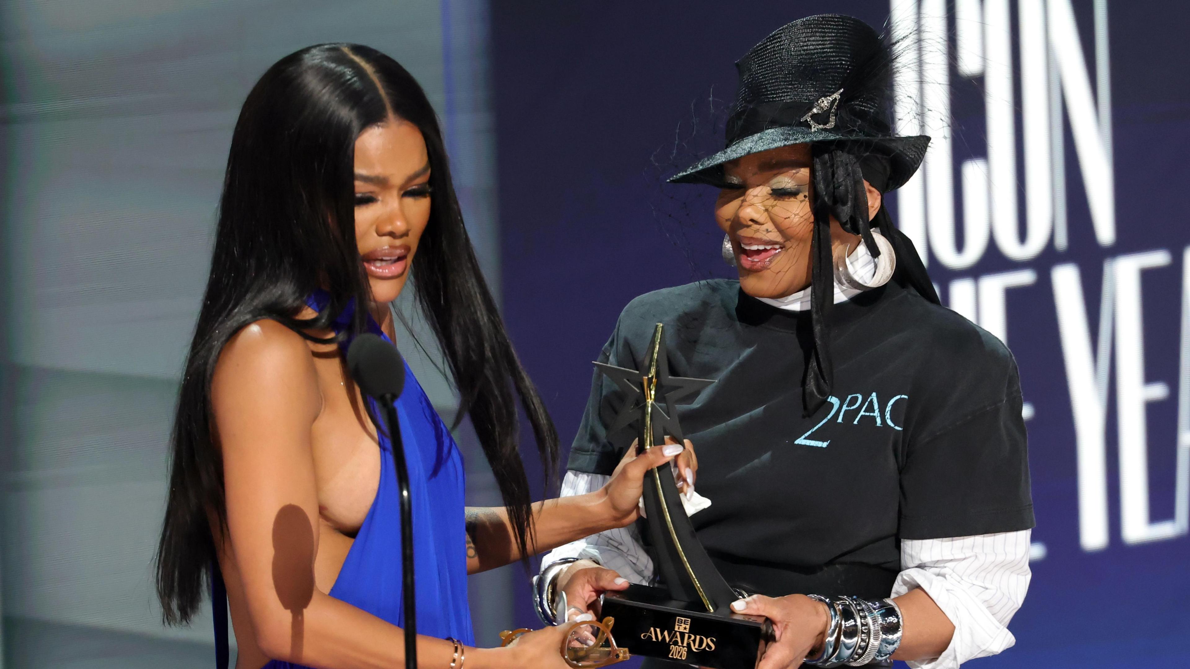 Teyana Taylor receiving Icon of the Year award from Janet Jackson