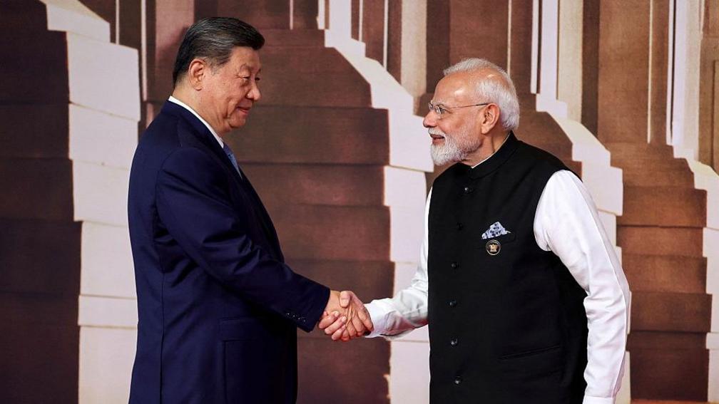 Modi shaking hands with Xi at BRICS summit