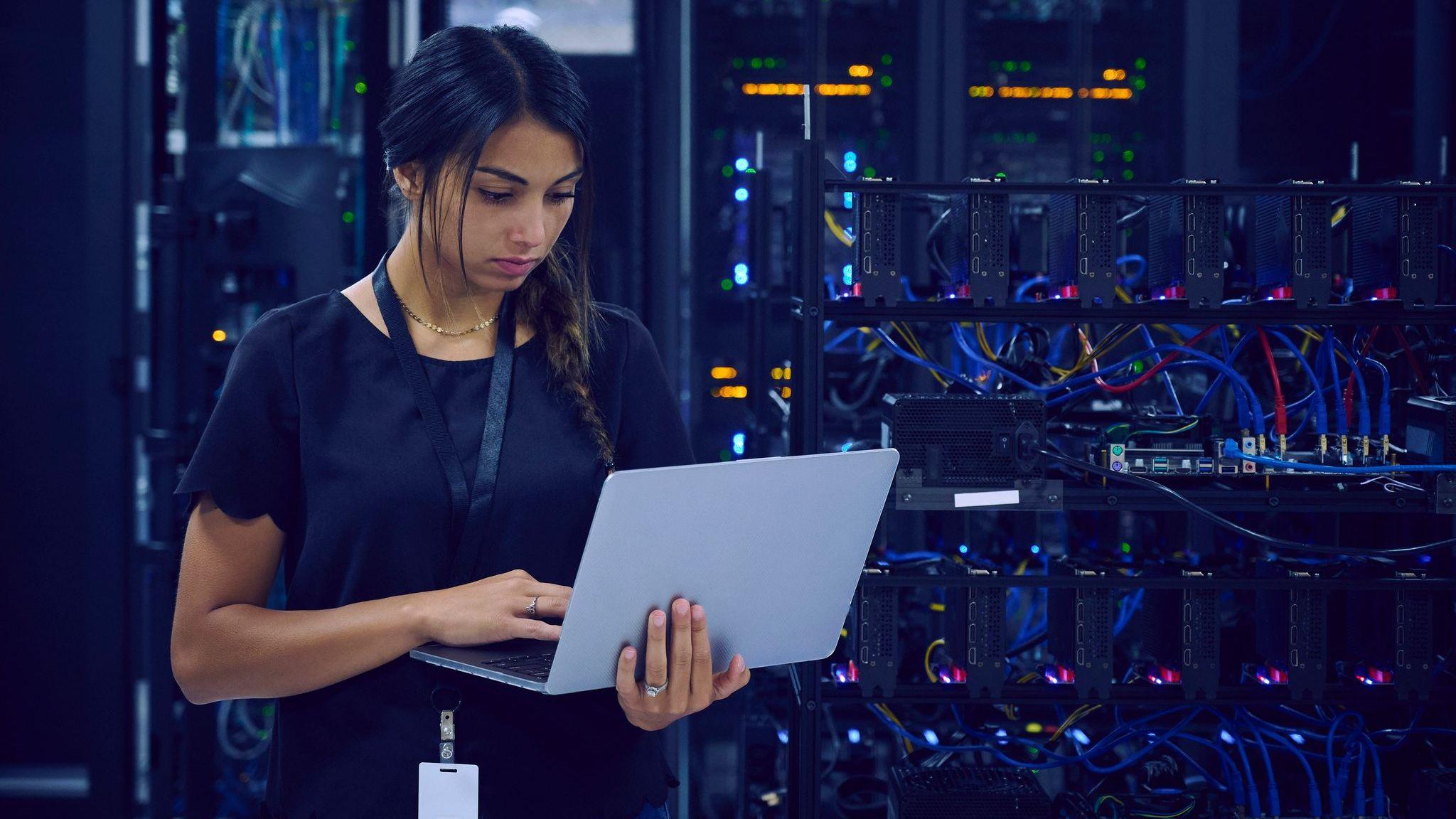 Female technician in a server room