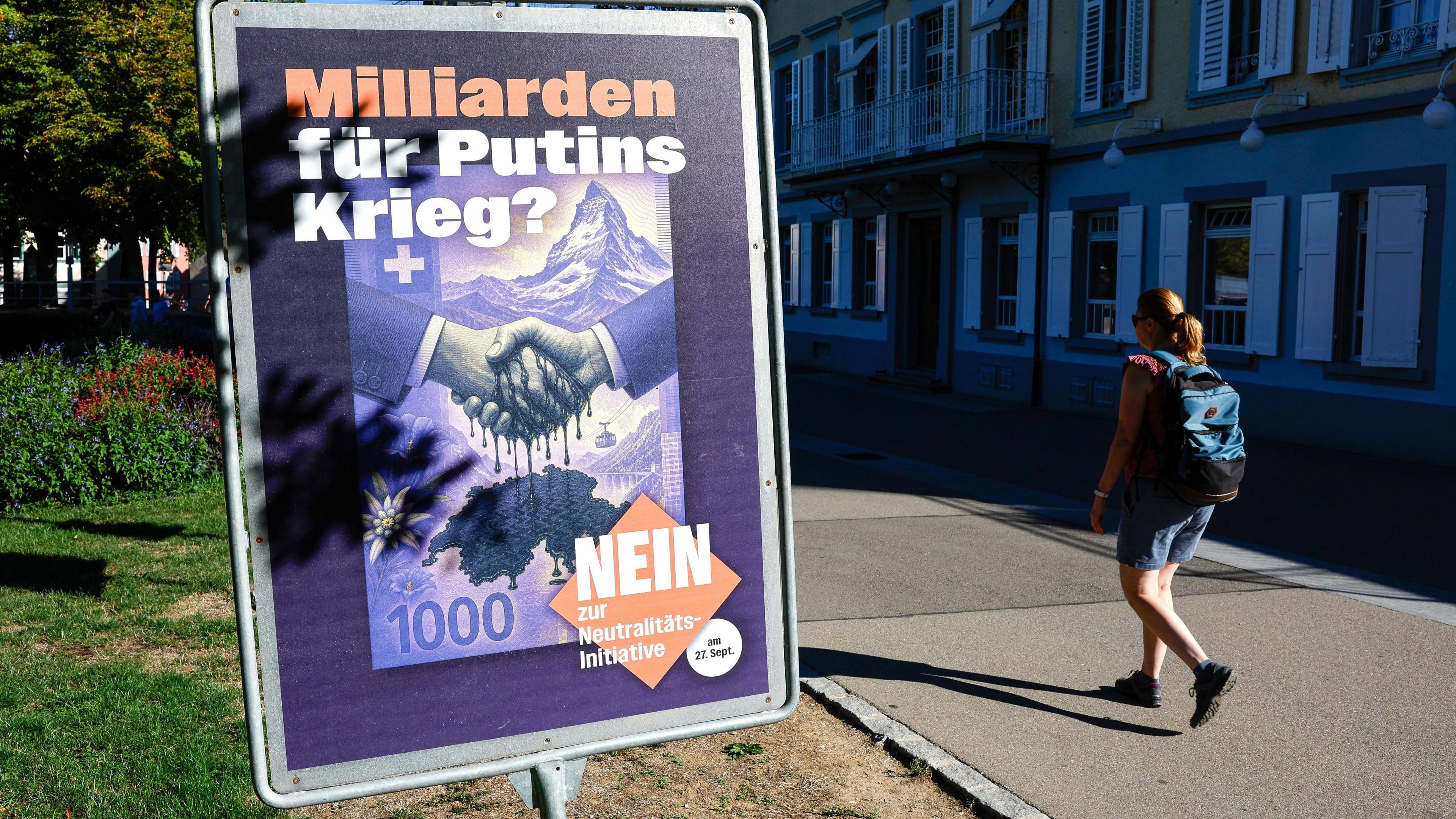 Woman with placard against neutrality vote in Rheinfelden
