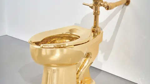 Ripley's Acquires $12M Golden Toilet in High-Profile Auction