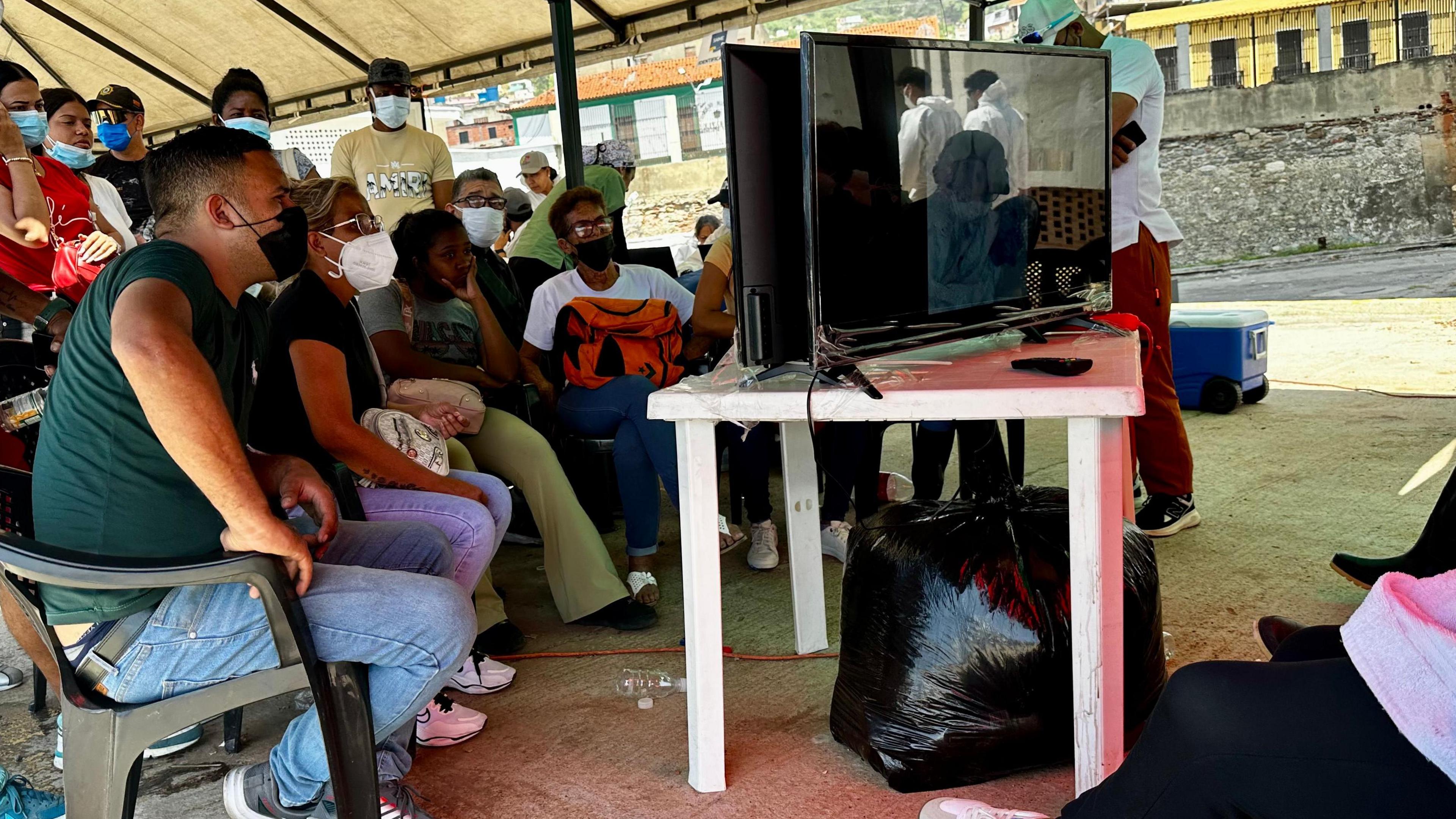 Families endure long waits to identify earthquake victims at makeshift morgue
