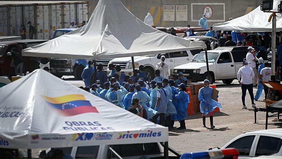 Families queue for hope as Venezuelan quake victims are identified in makeshift morgue