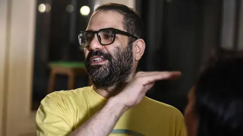 Alaa Abd El Fattah Faces Calls for Deportation Amid Apology for Past Tweets